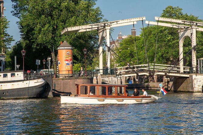 Private Boat Tour Amsterdam - 90 Min incl. welcome drink on historic saloon boat - A route built around your interests
