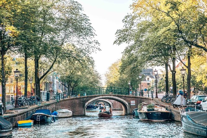 Private Romantic Canal Cruise Amsterdam with Bubbly and Snacks - The seven bridges and the open Amstel view