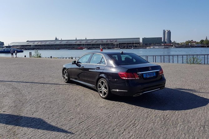 Schiphol Airport Private Transfer to Amsterdam with Meet & Greet - Finding the grey Meeting Point at Schiphol