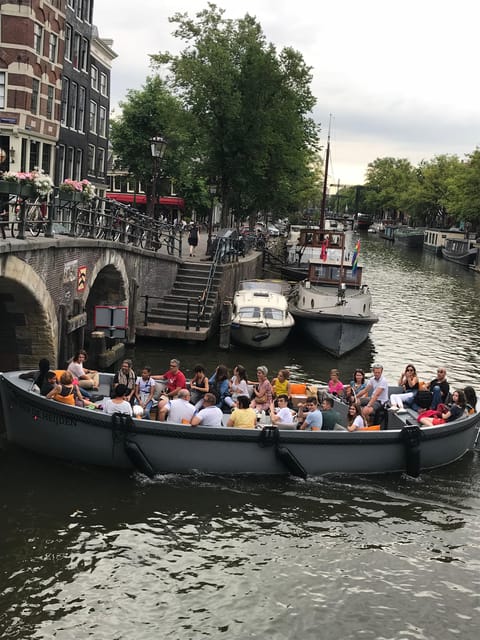 Visit Amsterdam by Boat with a French Guide (french) - French commentary and the Georges factor